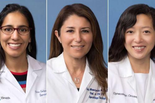 Three gynecologic oncologists at the UCLA Health Jonsson Comprehensive Cancer Center (JCCC) wearing white coats 